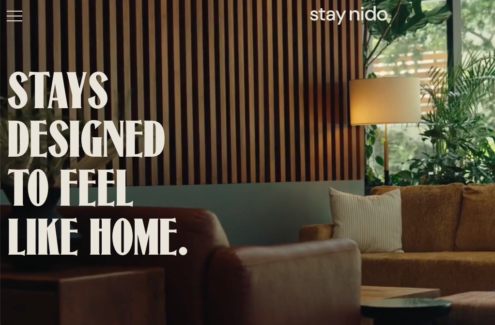 StayNido — rooftop terrace with 'Stays designed to feel like home' headline